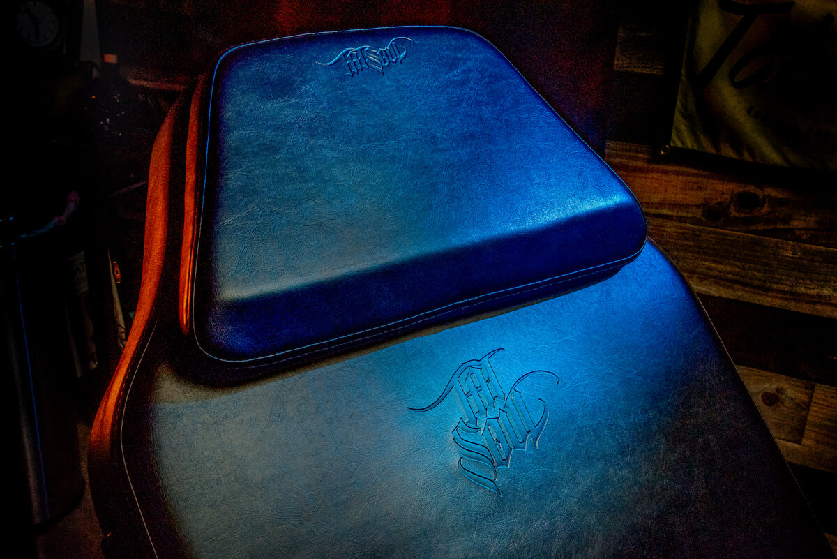 Close-up of the removable headrest on the Oros battery operated tattoo bed by TATSoul in a tattoo studio